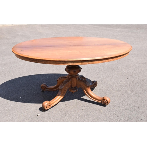 340 - Victorian tilt top table on ornate base. 146 x 105 x 75cm tall. In good functional condition though,... 