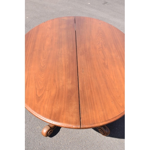 340 - Victorian tilt top table on ornate base. 146 x 105 x 75cm tall. In good functional condition though,... 