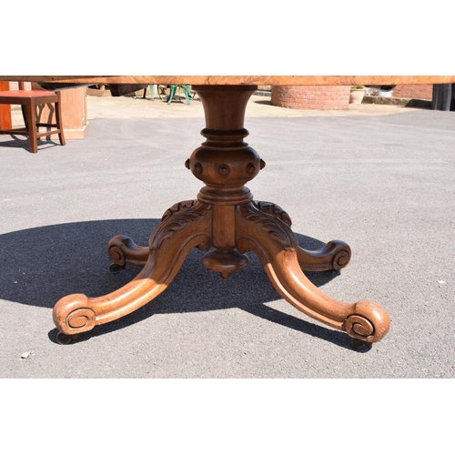 349 - Victorian tilt top table on ornate base. 146 x 105 x 75cm tall. In good functional condition though,... 