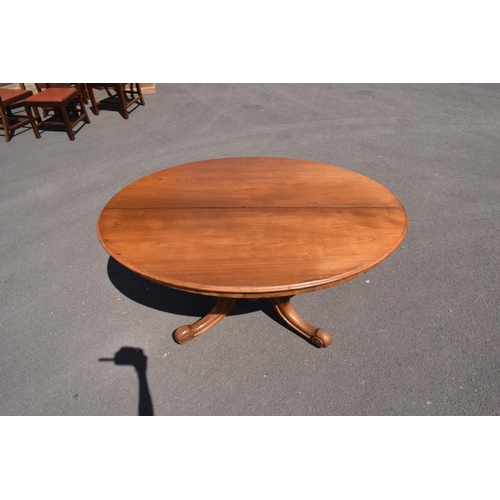 349 - Victorian tilt top table on ornate base. 146 x 105 x 75cm tall. In good functional condition though,... 