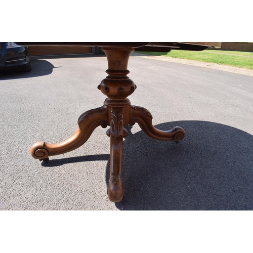 349 - Victorian tilt top table on ornate base. 146 x 105 x 75cm tall. In good functional condition though,... 