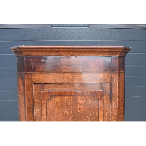 354 - A Georgian period oak corner cupboard with raised sections and a single drawer. 128cm tall, 82cm at ... 