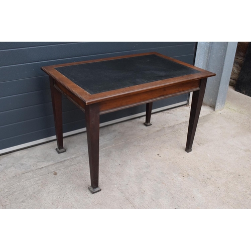 358 - An early 20th century side table / desk with a dark leather insert. 115 x 76 x 77cm. In good functio... 