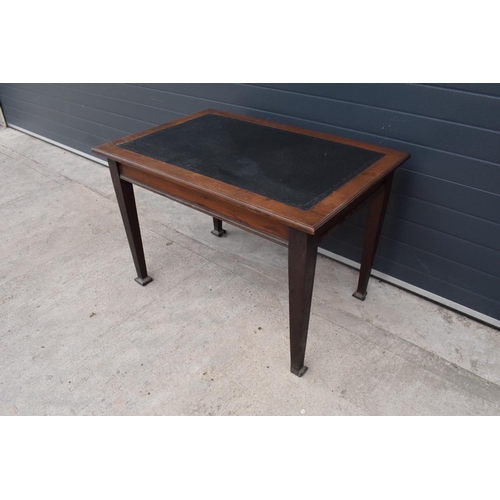 358 - An early 20th century side table / desk with a dark leather insert. 115 x 76 x 77cm. In good functio... 