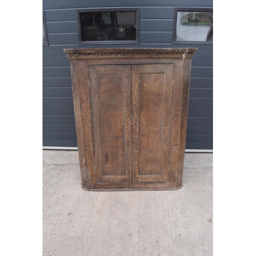 360 - Large early 19th century oak farmhouse double corner cupboard. 138cm tall. 113cm widest. 62cm deepes... 