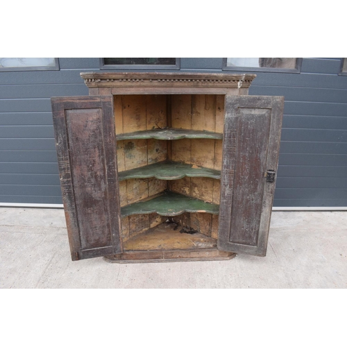 360 - Large early 19th century oak farmhouse double corner cupboard. 138cm tall. 113cm widest. 62cm deepes... 