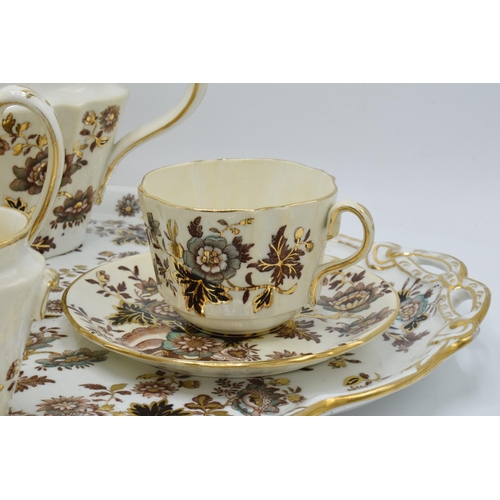 17 - An English 19th century tea for two set to consist of a teapot, 2 duos, milk and sugar and a large t... 