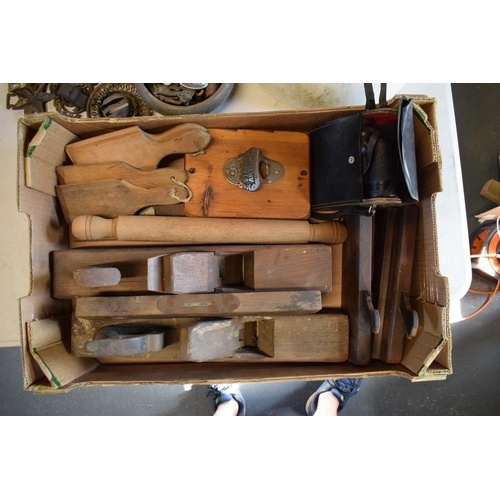 202 - A mixed collection of items to include wooden planes, Hanimex 8x30 binoculars in case, vintage rolli... 