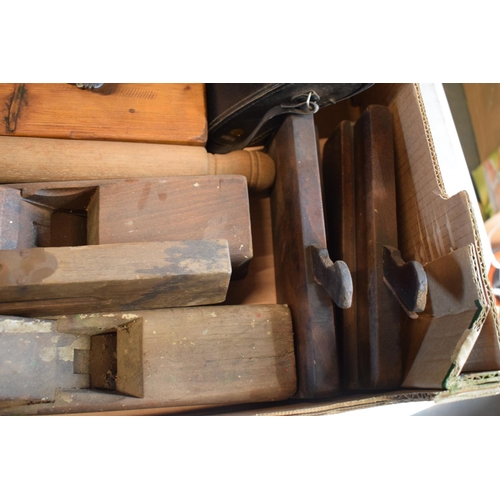 202 - A mixed collection of items to include wooden planes, Hanimex 8x30 binoculars in case, vintage rolli... 