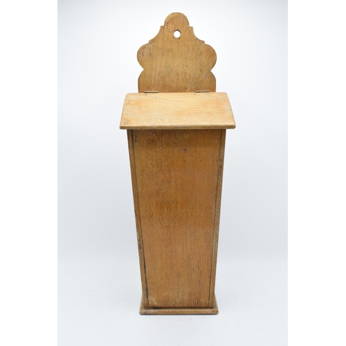 212 - A Victorian light-coloured wooden candle box / salt box with working hinges. 53cm tall. Generally in... 