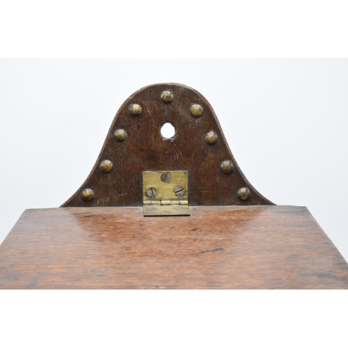 213 - A 19th century Victorian wooden candle box/ salt box with lift up lid and brass beading. 38cm tall. ... 