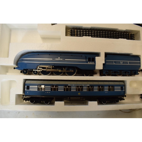 229 - A boxed Hornby Coronation Scot electric train set R.386 together with Hornby metre length and simila... 