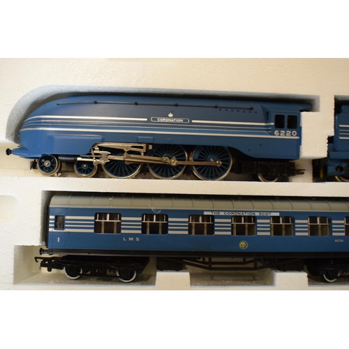 229 - A boxed Hornby Coronation Scot electric train set R.386 together with Hornby metre length and simila... 