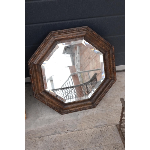 234 - A collection of items to include a carved oak octagonal mirror, a rectangular mirror and a brass and... 