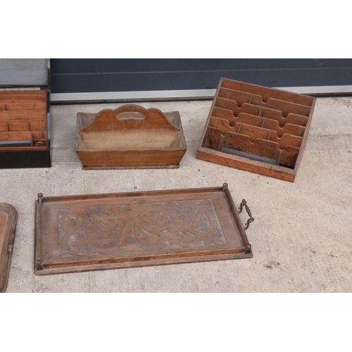 235 - A collection of wooden items to include carved wooden serving trays, a vegetable picking tray, a woo... 