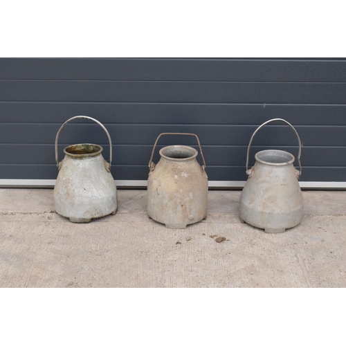 240 - A collection of aluminium milk churns/ buckets/ pails with handles (3). Approx 54cm tall. All in goo... 