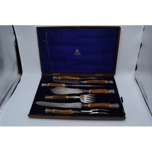 250 - A wooden cased Mappin and Webb horn and silver handled 7-piece carving set with silver banding and t... 