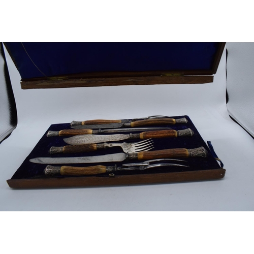 250 - A wooden cased Mappin and Webb horn and silver handled 7-piece carving set with silver banding and t... 