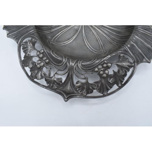 256 - An Art Nouveau WMF pewter dish raised on 4 ball feet stamped 'WMF'. 26cm long .In good condition wit... 