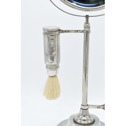 261 - A chrome plated adjustable gentleman's shaving stand complete with an associated jug and brush. The ... 