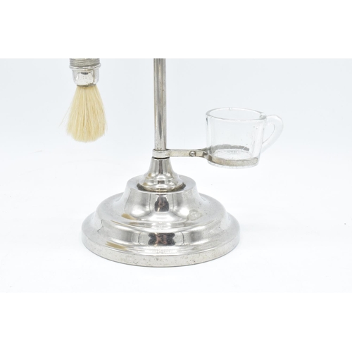 261 - A chrome plated adjustable gentleman's shaving stand complete with an associated jug and brush. The ... 