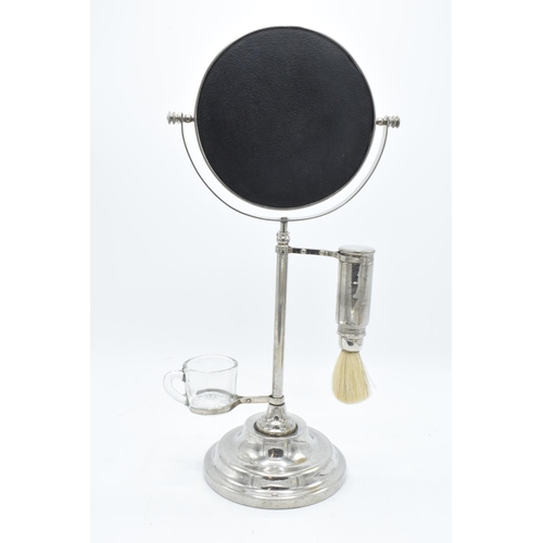 261 - A chrome plated adjustable gentleman's shaving stand complete with an associated jug and brush. The ... 