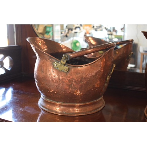 270 - A pair of copper coal buckets to include a hammered Victorian bucket together with a later example (... 