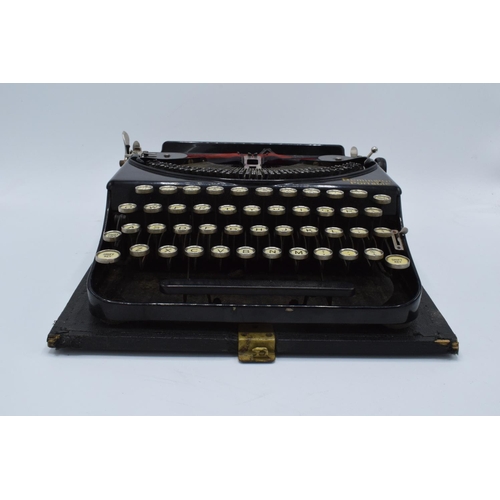 272 - Cased Remington Portable typewriter. Sold as spares/ repairs. Untested.