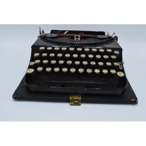 272 - Cased Remington Portable typewriter. Sold as spares/ repairs. Untested.