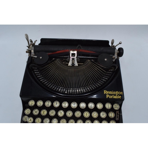 272 - Cased Remington Portable typewriter. Sold as spares/ repairs. Untested.