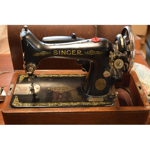 273 - Cased electric Singer sowing machine, assumed spares as untested.