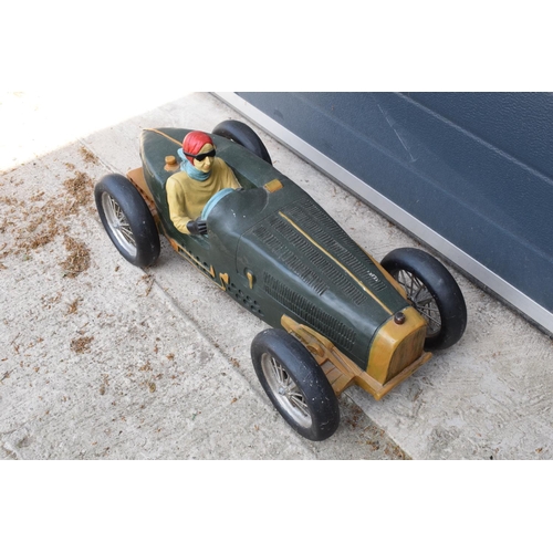 281 - A vintage Reprocrafters style large model of a vintage car. 67cm long. In good condition generally t... 