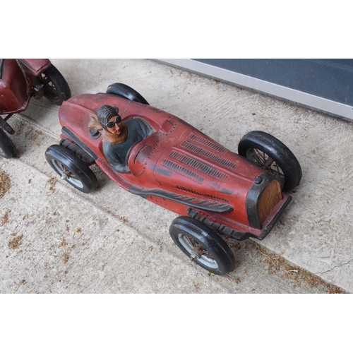 282 - A vintage Reprocrafters style large model of a vintage car. 56cm long togerher with a similar exampl... 