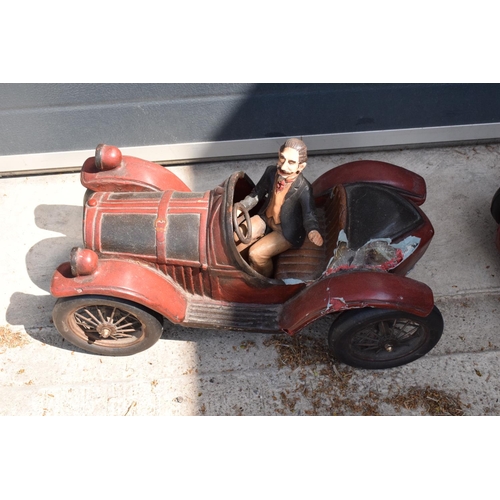 282 - A vintage Reprocrafters style large model of a vintage car. 56cm long togerher with a similar exampl... 