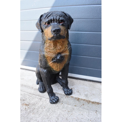 283 - A large resin lifesize figure of a Rottweiler or similar dog. In good condition with some wear. 62cm... 