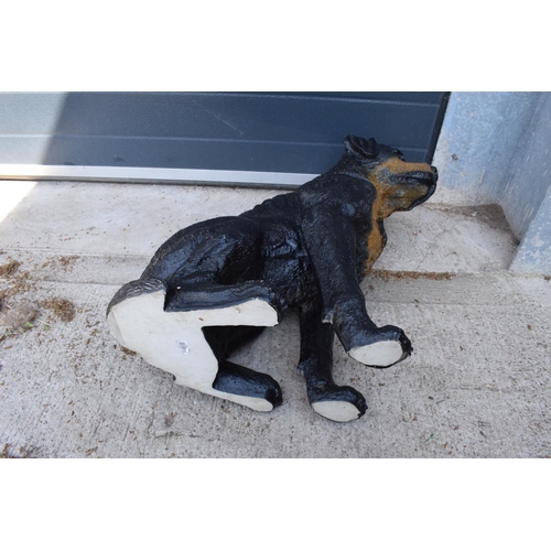 283 - A large resin lifesize figure of a Rottweiler or similar dog. In good condition with some wear. 62cm... 