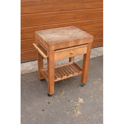 289 - A modern 20th century mounted butcher's block on wheels with a drawer. 70 x 52 x 85cm. In good funct... 