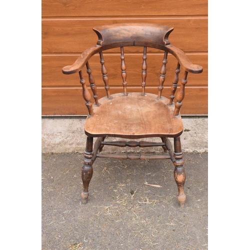 292 - A late 19th century elm or similar wood captain's chair. 79cm tall. In good functional condition tho... 