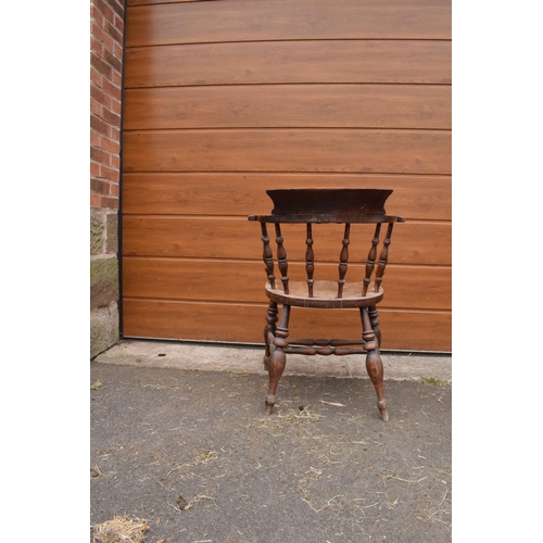 292 - A late 19th century elm or similar wood captain's chair. 79cm tall. In good functional condition tho... 