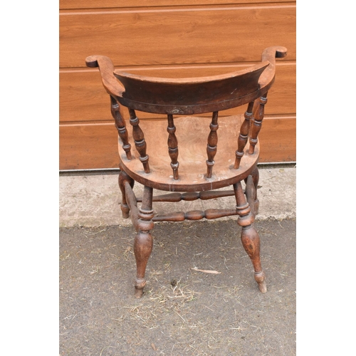 292 - A late 19th century elm or similar wood captain's chair. 79cm tall. In good functional condition tho... 