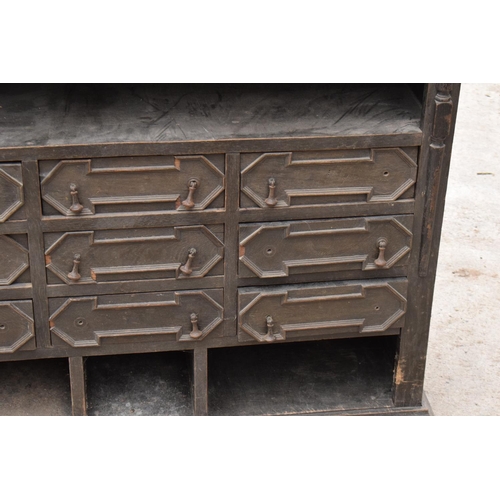 294 - Early 20th century oak free standing cupboard with 9 draws. 104 x 32 x 82cm. In good functional cond... 