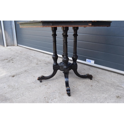 297 - Victorian ebonised aesthetic movement octagonal centre table with brass beading and chamfered edges ... 