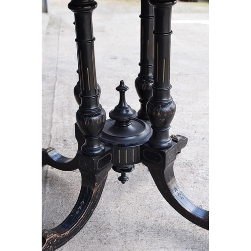 297 - Victorian ebonised aesthetic movement octagonal centre table with brass beading and chamfered edges ... 