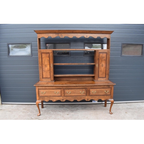 299 - A good quality reproduction Georgian style oak dresser set on cabriole legs with marquetry and inlay... 