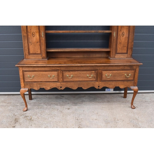 299 - A good quality reproduction Georgian style oak dresser set on cabriole legs with marquetry and inlay... 