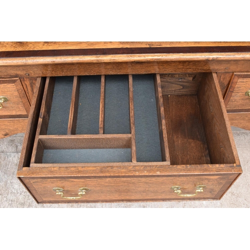 299 - A good quality reproduction Georgian style oak dresser set on cabriole legs with marquetry and inlay... 