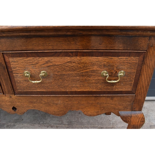 299 - A good quality reproduction Georgian style oak dresser set on cabriole legs with marquetry and inlay... 