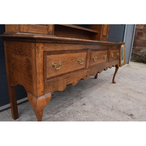 299 - A good quality reproduction Georgian style oak dresser set on cabriole legs with marquetry and inlay... 