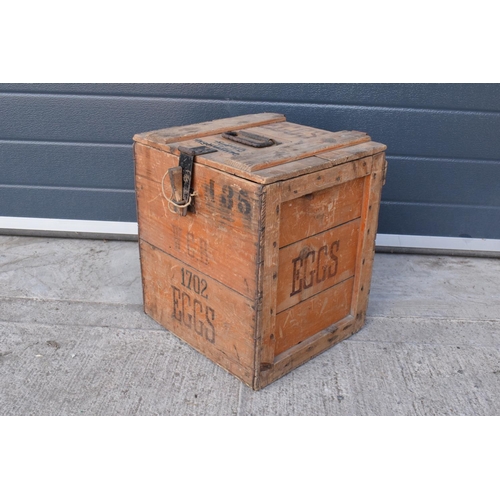 313 - A vintage 20th century wooden egg crate with either 'WCB' or 'WGB' with 'EGGS' on each side and a bo... 