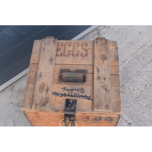 313 - A vintage 20th century wooden egg crate with either 'WCB' or 'WGB' with 'EGGS' on each side and a bo... 